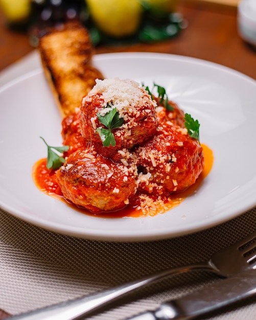 Free Photo Top View Of Meatballs Plate Garnished With Tomato Sauce