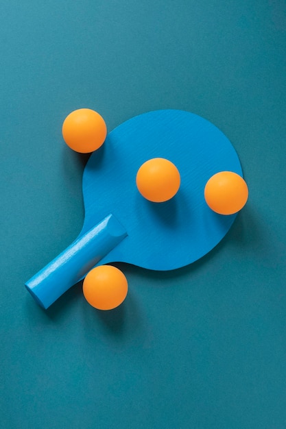 Free Photo | Top view of new ping pong paddle with balls