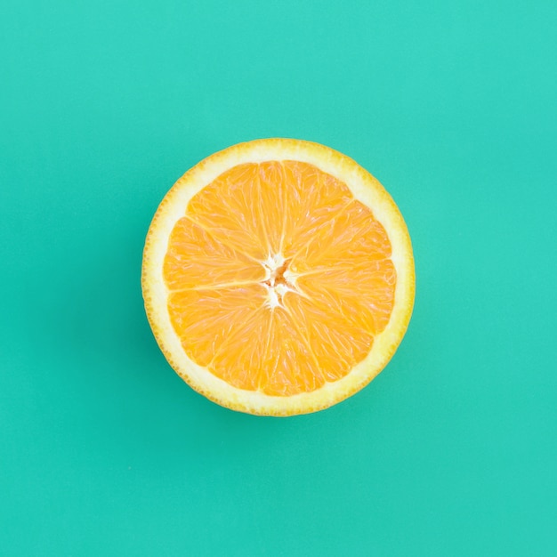 Premium Photo Top View Of A One Orange Fruit Slice On Bright Background In Turquoise Green Color,Best Kitchen Appliances Brand 2020