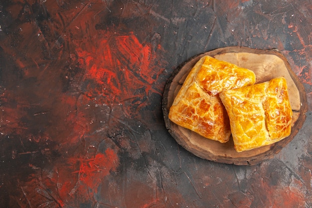 Free Photo | Top view of penovani khachapuri on wood board on dark red ...