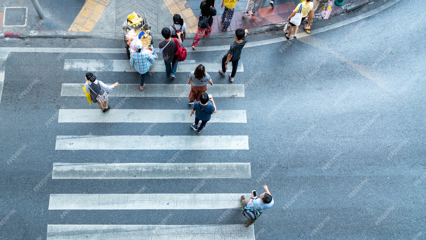 Premium Photo | Top view of people walk across road with signage ...