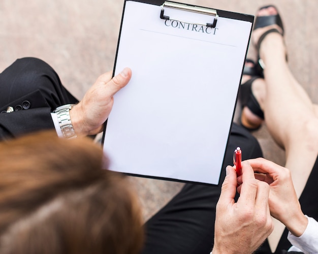 Top view person signing with copy space Free Photo