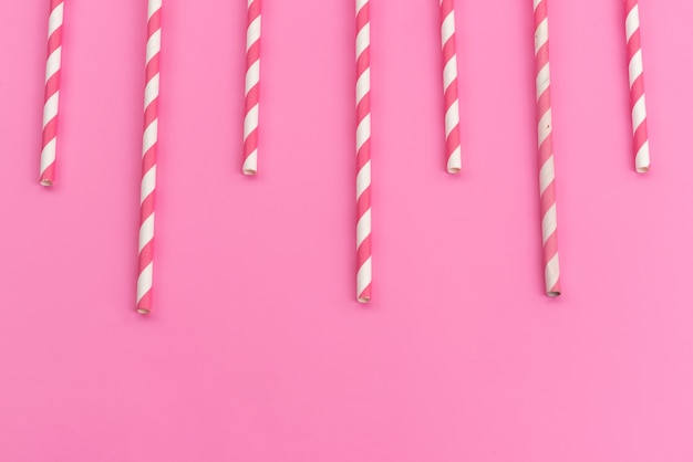 Free Photo | A top view pink-white candy sticks delicious sticky on ...