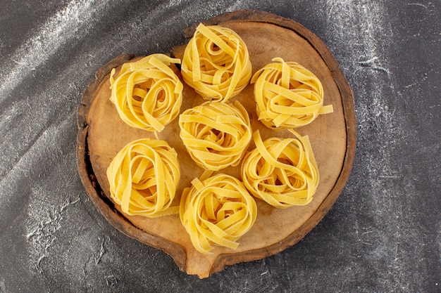 Free Photo | Top view shaped italian pasta in flower form raw and ...