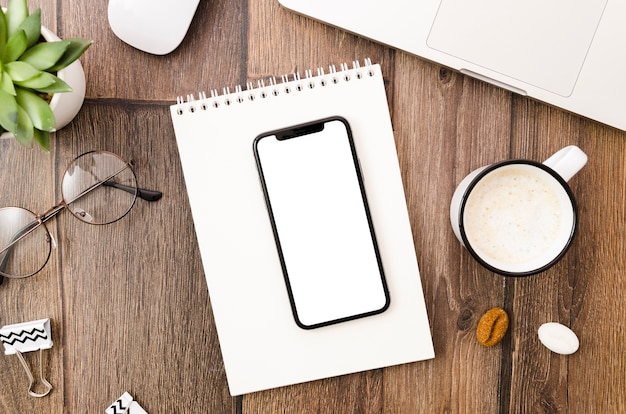 Top view smartphone template over workspace | Free Photo
