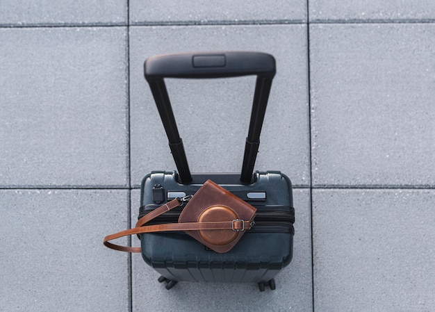 bag on top of suitcase