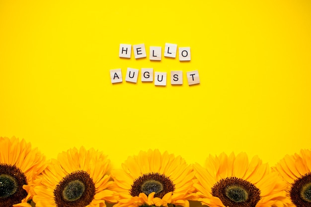 Premium Photo | Top View Sunflowers With Hello August Message