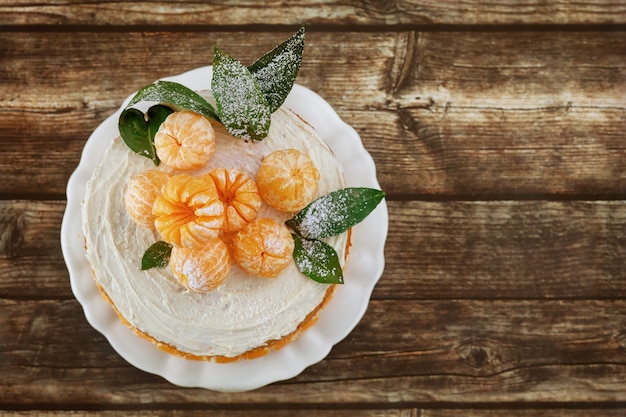 Premium Photo Top View Of Tangerines Naked Cake With Leaves On Rustic Background