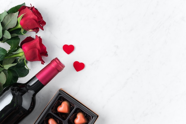 Premium Photo | Top view of valentine day chocolate with rose and wine ...