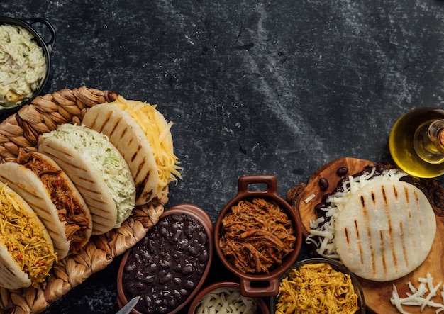 Premium Photo | Top view of various types of typical venezuelan arepas