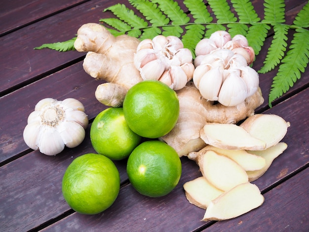Premium Photo | Top view of vegetables and herbs for cooking with turmeric  root, ginger, garlic and lemon fruit.