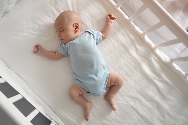 Top View Wide Angle Sleeping Newborn Baby Lies Crib Arms Legs Outstretched Baby Sleep 108611 1239 