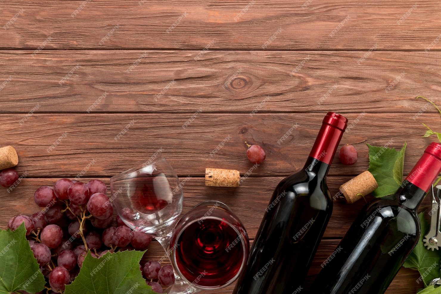 Free Photo | Top view wine bottles on wooden background