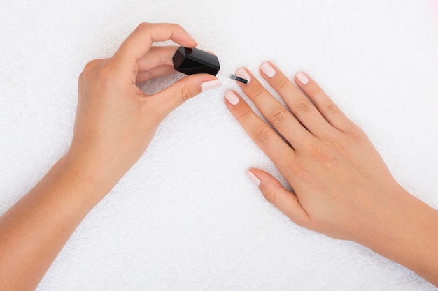 Free Photo Top View Woman Applying Nail Polish