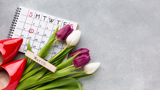 Top view women's day concept composition with calendar Free Photo