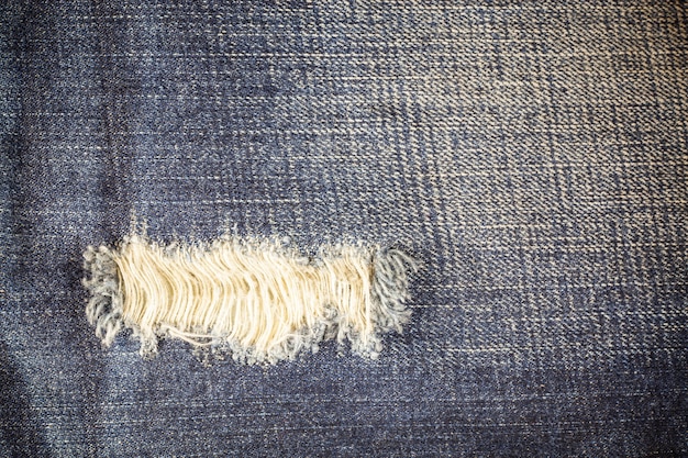 Premium Photo | Torn denim dirty jeans texture
