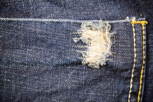 Premium Photo | Torn denim dirty jeans texture