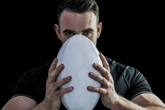 premium-photo-tough-rugby-player-holding-ball