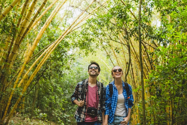 Free Photo | Tourist couple having fun in forest