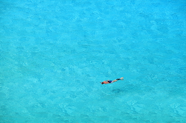 Premium Photo | Tourists enjoying the clear waters and beautiful of ...