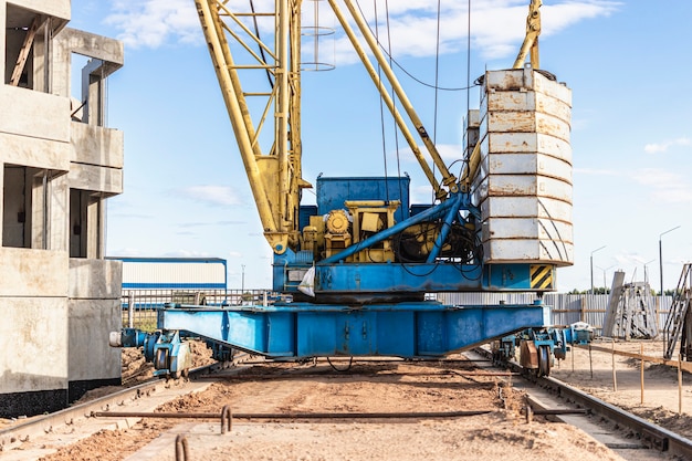 Premium Photo | Tower crane on rails close-up against the background of ...