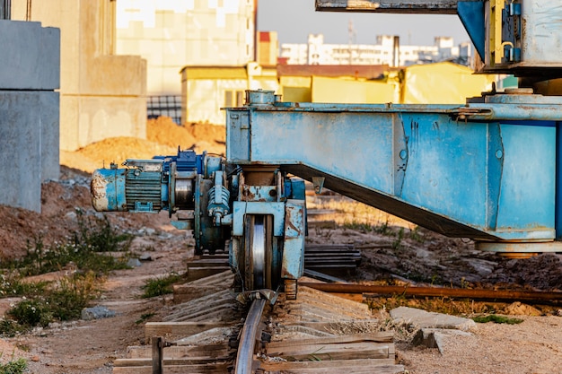 Premium Photo | Tower crane on rails close-up against the background of ...