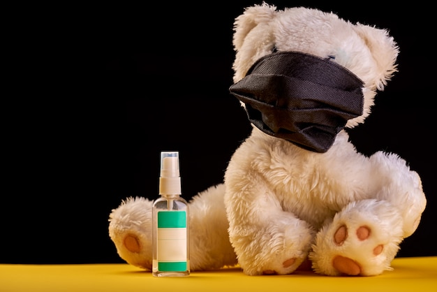 Premium Photo | A toy bear in a medical black mask