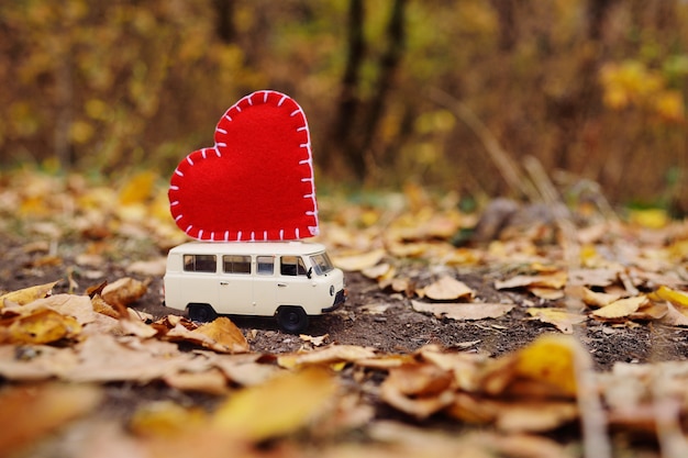 red toy car with yellow roof