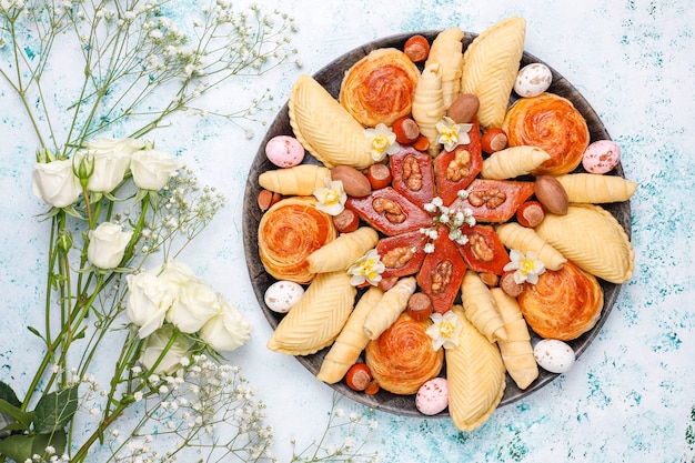 Traditional azerbaijan holiday novruz cookies baklavas and shakarburas on black tray plate Premium P
