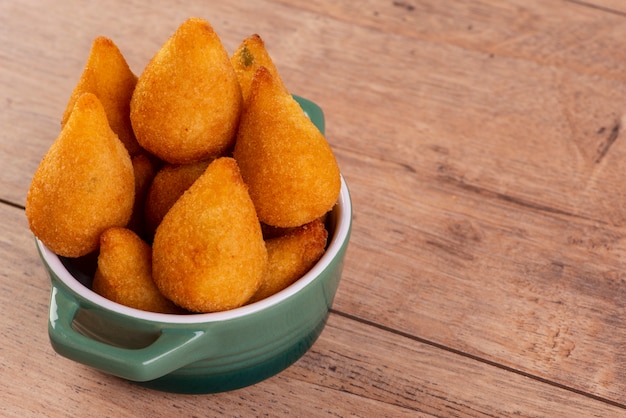 premium-photo-traditional-brazilian-fried-snack-stuffed-with-chicken