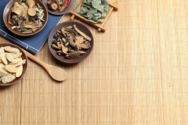 Traditional Chinese medicine on bamboo desk Photo | Free ...