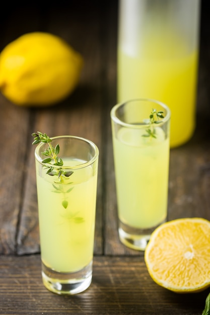 Premium Photo | Traditional italian lemon liqueur limoncello and fresh ...