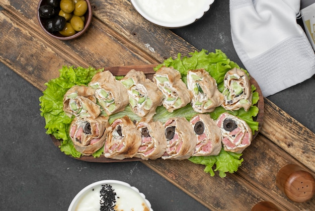 Free Photo | Traditional lavash rolls with olives and white cheese. top ...