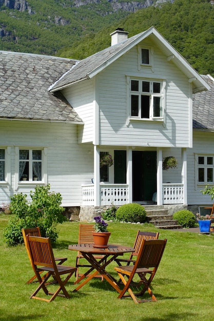 Premium Photo | Traditional Norwegian Wooden House Standing On A Lawn ...