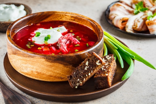 Premium Photo | Traditional russian borsch with sour cream, rye ...