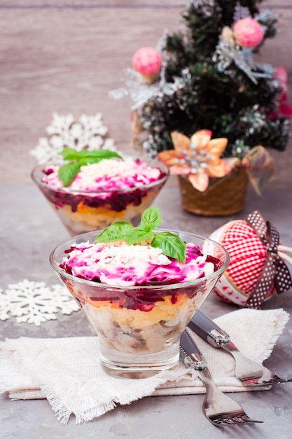 Traditional Russian Salad Herring Under A Fur Coat In Bowls In