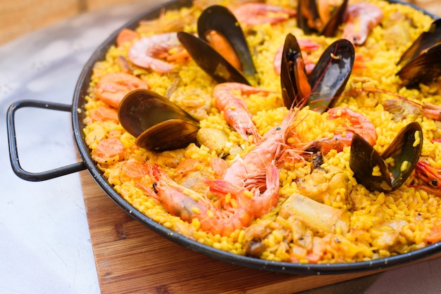 Premium Photo | Traditional spanish dish paella with prawns and mussels