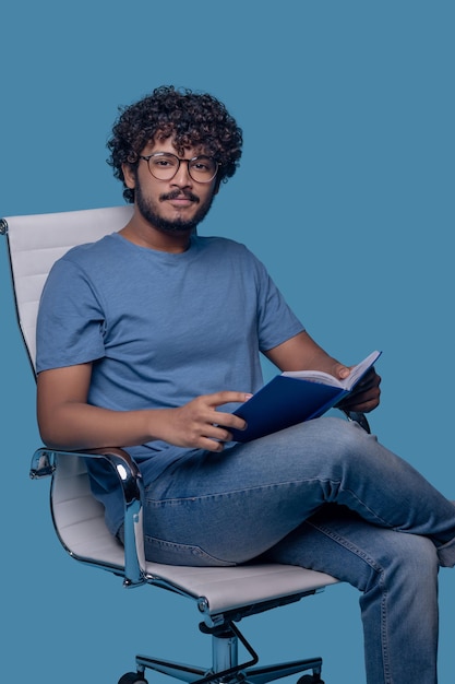 premium-photo-tranquil-guy-in-eyeglasses-posing-for-the-camera-during