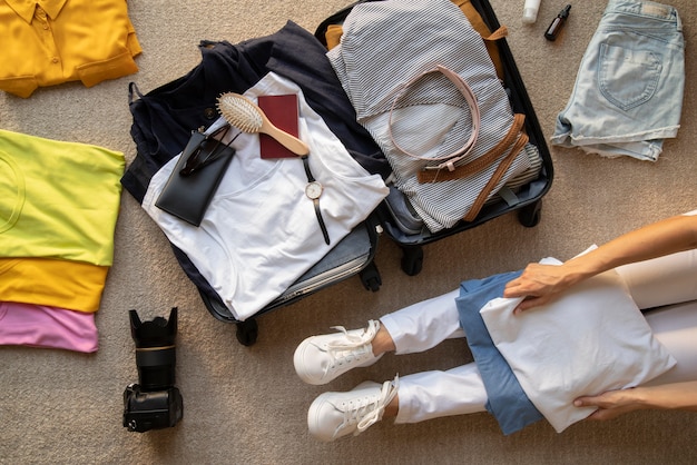Travel suitcase and preparations packing Free Photo