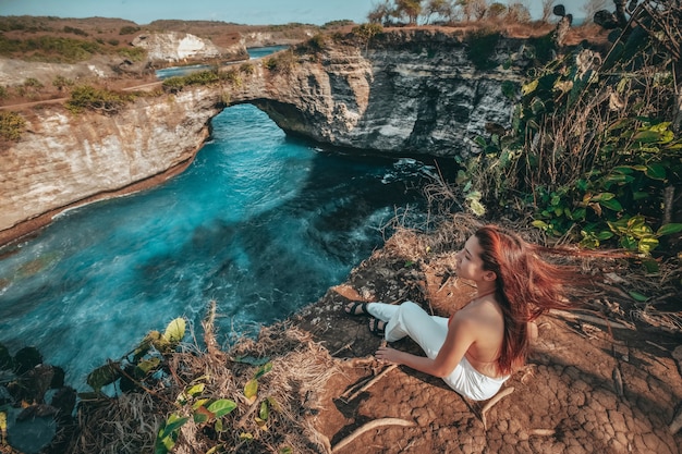 Premium Photo Travel Woman Looking View Of Broken Beach Nusa Penida