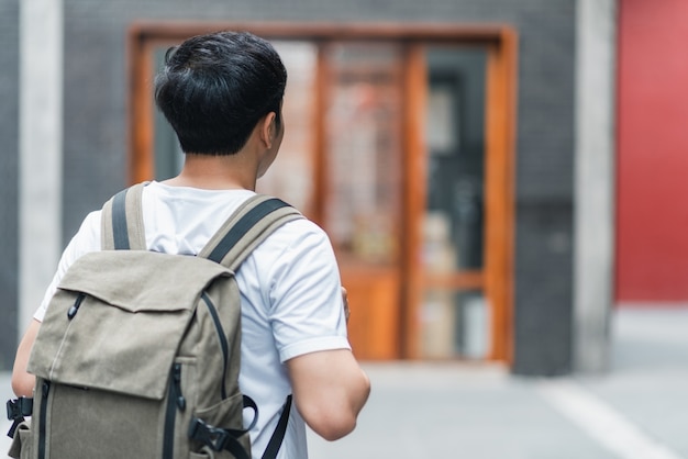 Free Photo | Traveler asian man traveling and walking in beijing, china