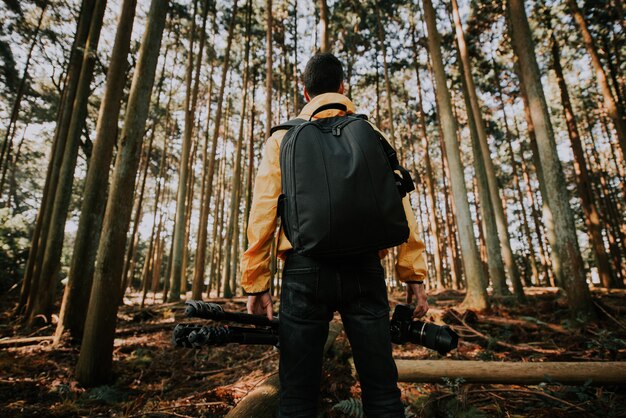 Premium Photo | Traveler man discovering new places in the wild nature