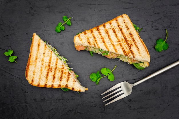 Free Photo | Triangular sandwiches with parsley and fork