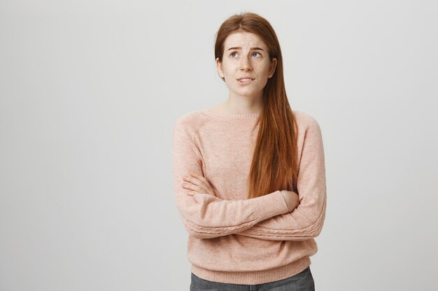 Free Photo | Troubled redhead teenage girl looking up anxious, have ...