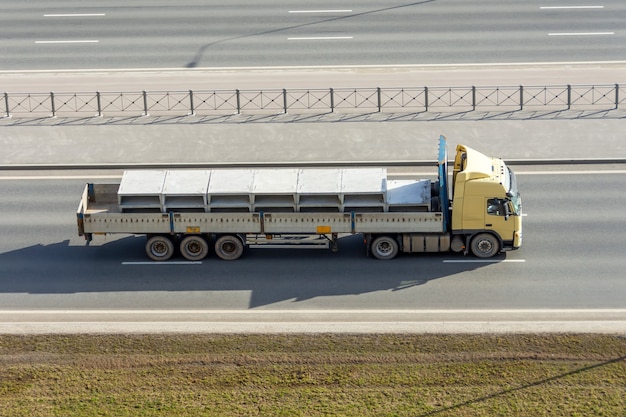 premium-photo-truck-with-a-fully-loaded-concrete-block-driving-on-the