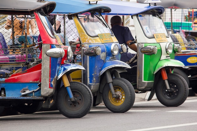 Premium Photo | Tuk tuk at a car that is unique in thailand