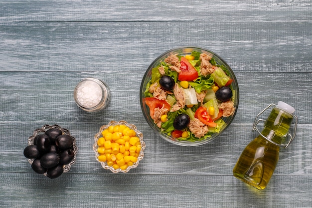 Free Photo Tuna Salad With Lettuce Olives Corn Tomatoes Top View