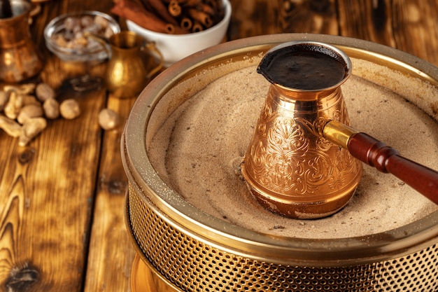 Premium Photo | Turkish coffee in cezve on the sand