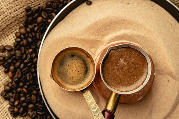 Premium Photo | Turkish coffee prepared in sand with turk