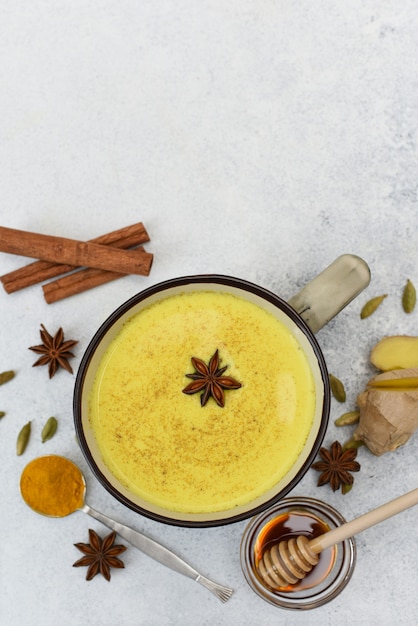 Premium Photo | Turmeric latte top view. golden milk in cup with star ...